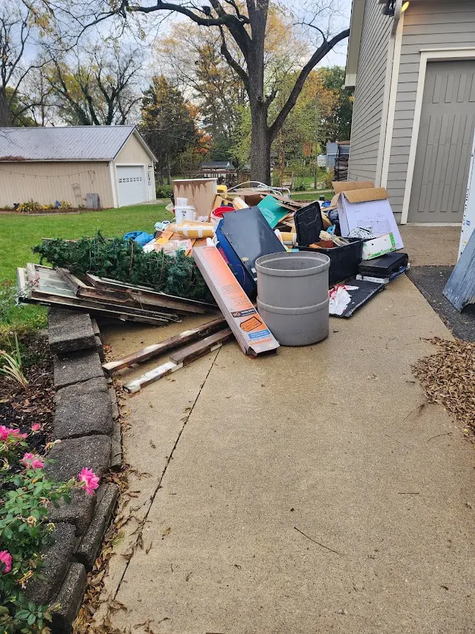 Dumpster being loaded with debris for Commercial Dumpster Rental in Bellingham